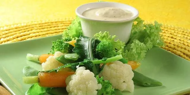 Cooked vegetables in tofu sauce with sesame