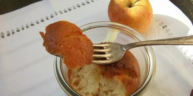 A cake with an apple in a jar