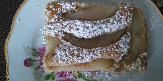 A cake with pears and walnuts