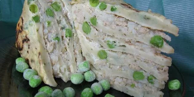 A complex of pancakes with peas