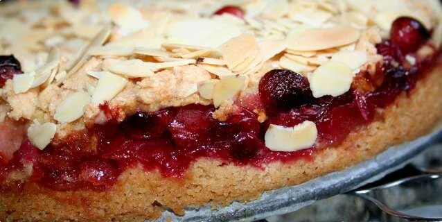 A cake with apples and cranberries